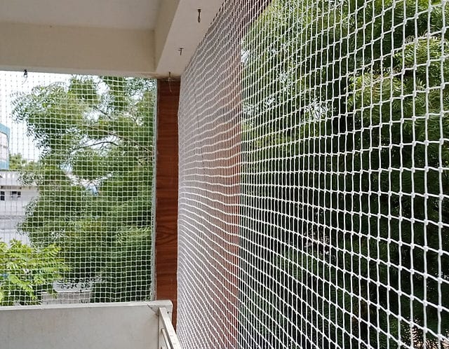 Balcony safety net installation in apartment